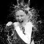 Photography Club -Photo of a student in black and white with water splashed on them