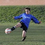 Sports Clubs - Photoof a student kicking a ball