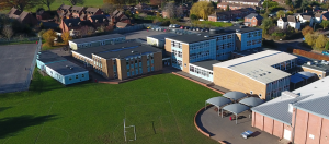 An aerial photo of the school taken from a drone of the school and field a hundred feet in the air