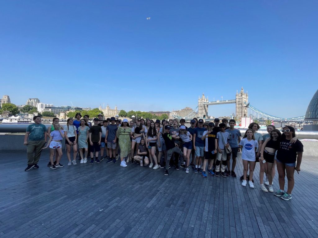 Photo of group of students stood infront of a river in London